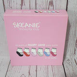 Pink box of Skeanie Mary Jane baby socks on a wooden surface